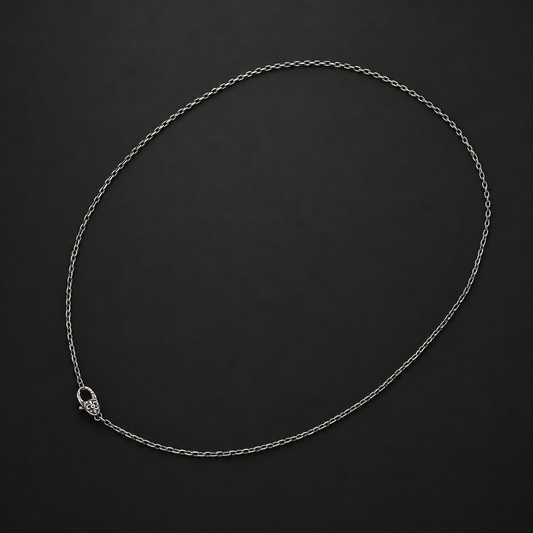 Gothic fine-link necklace chain with an ornate floral clasp on a dark background, 45–50 cm.